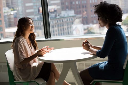 Two employees resolving a conflict