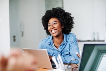 Employee smiling during a meeting